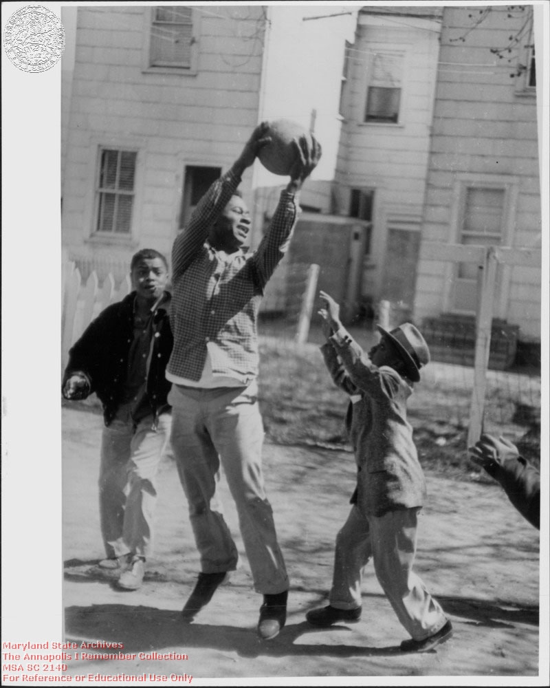 1955 c. Ochs, Irving Black children playing basketball