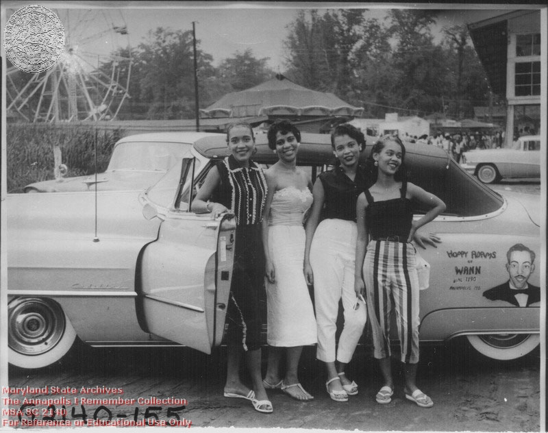 1956 c. Unknown Carr's Beach, four women in front of Hoppy Adam's car